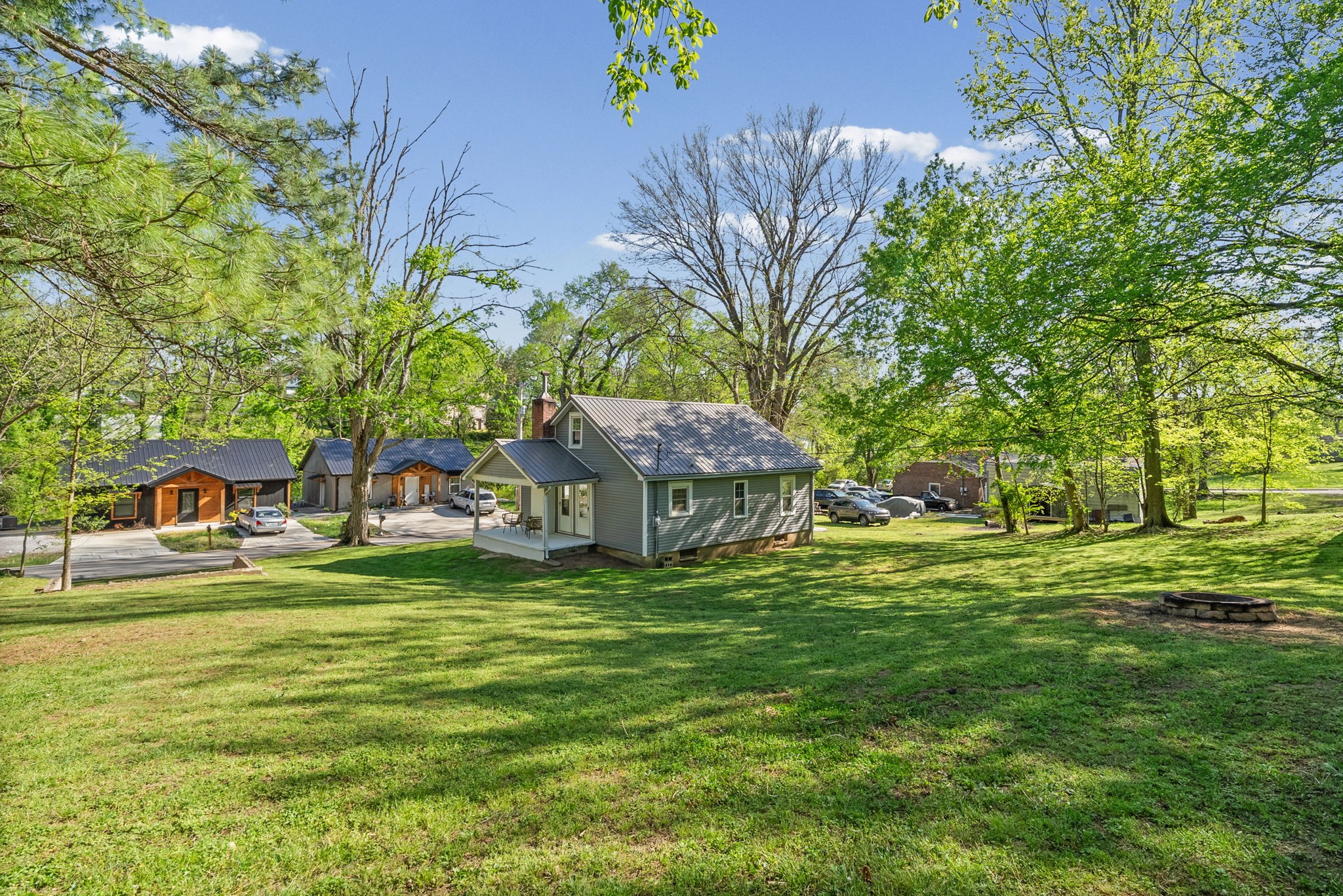 59 Perry Street Cadiz, KY 42211 - Photo 23 of 32 a garden with trees in front of it