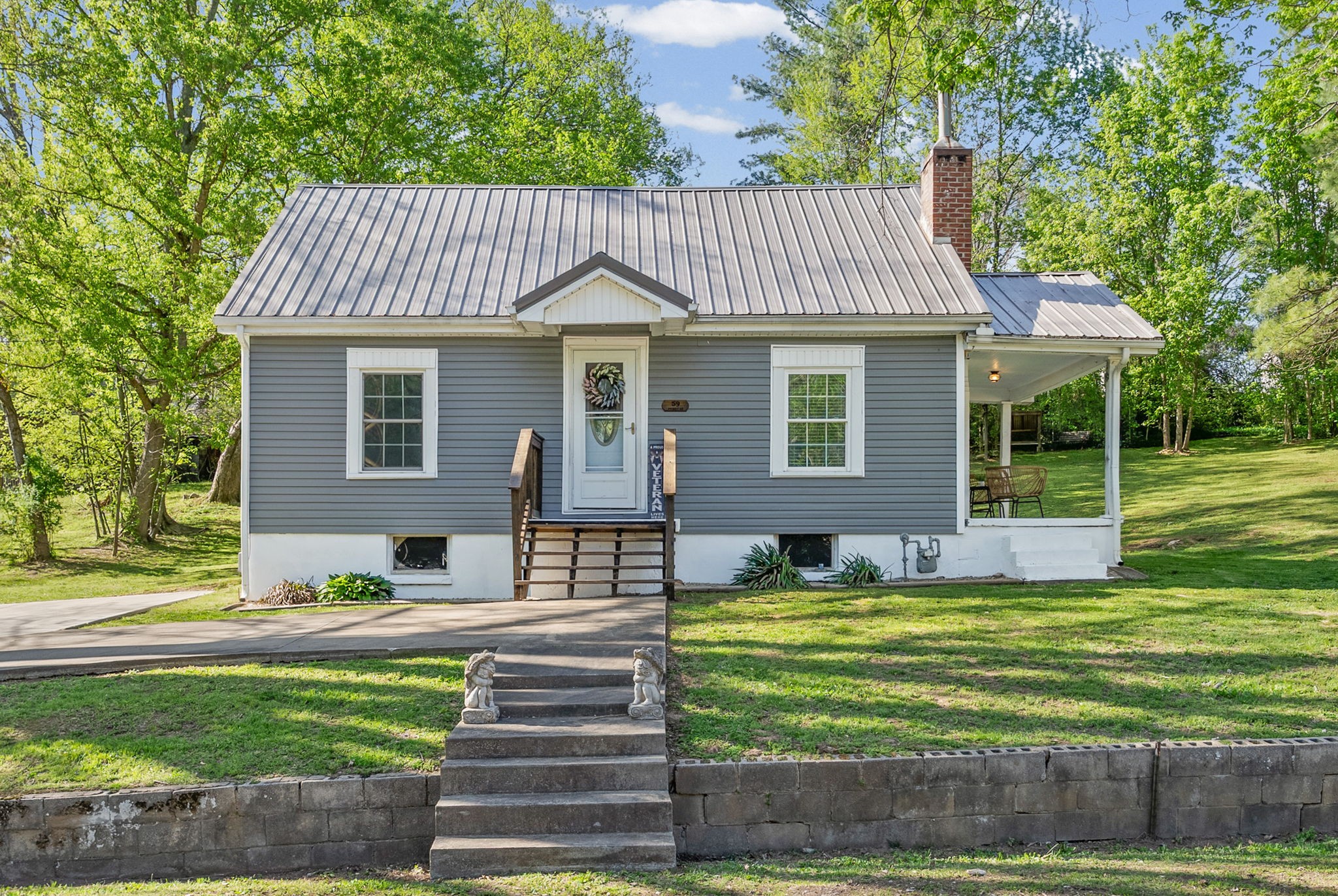 59 Perry Street Cadiz, KY 42211 - Photo 28 of 32 a front view of a house with a garden