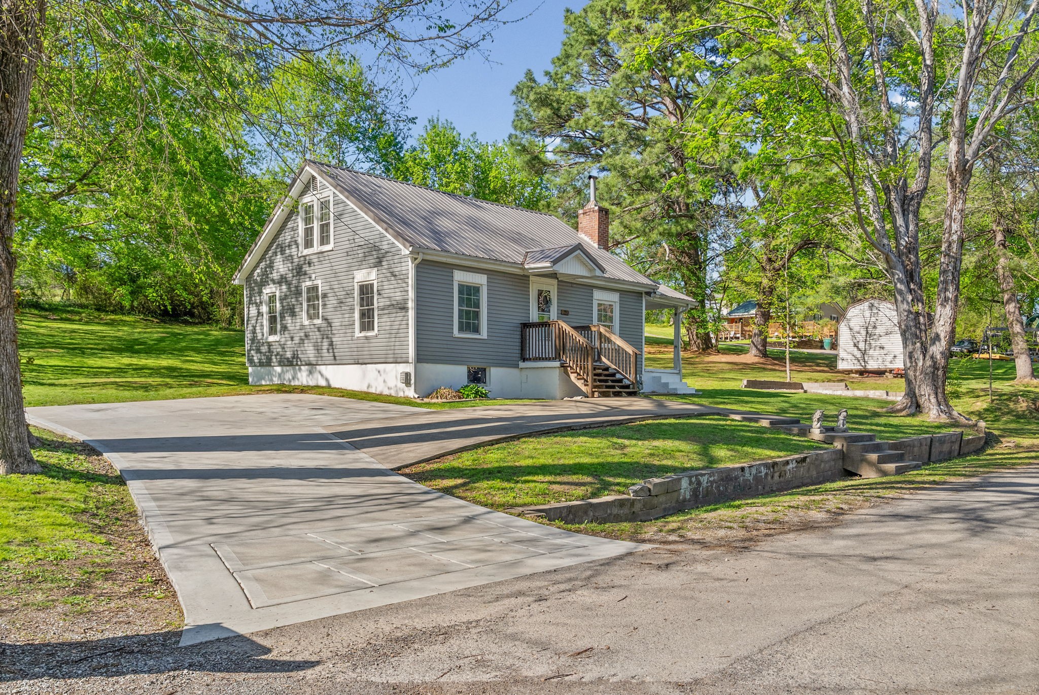 59 Perry Street Cadiz, KY 42211 - Photo 29 of 32 a view of a house with a yard patio and a road