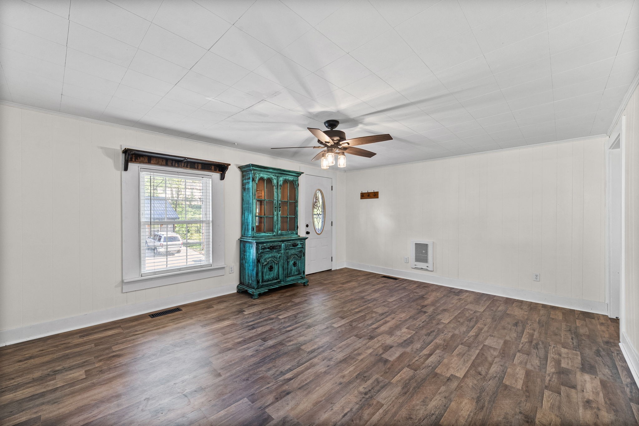 59 Perry Street Cadiz, KY 42211 - Photo 6 of 32 a view of an empty room with a window and wooden floor