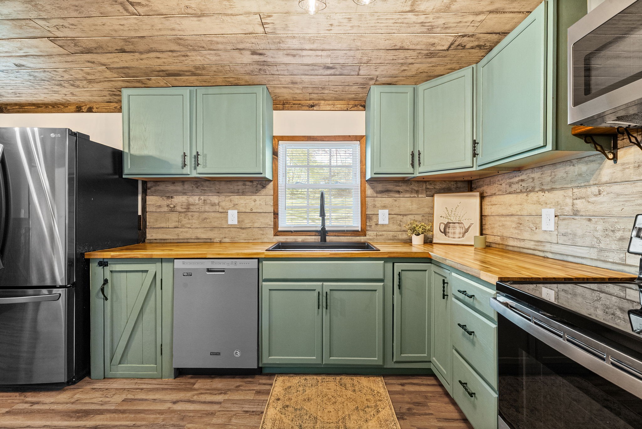 59 Perry Street Cadiz, KY 42211 - Photo 8 of 32 a kitchen with stainless steel appliances granite countertop a sink stove and refrigerator