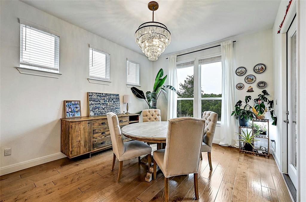 170 Climbing Rock Loop Dripping Springs, TX 78620 - Photo 6 of 30 Hardwood floors and generous natural light create an inviting dining space.