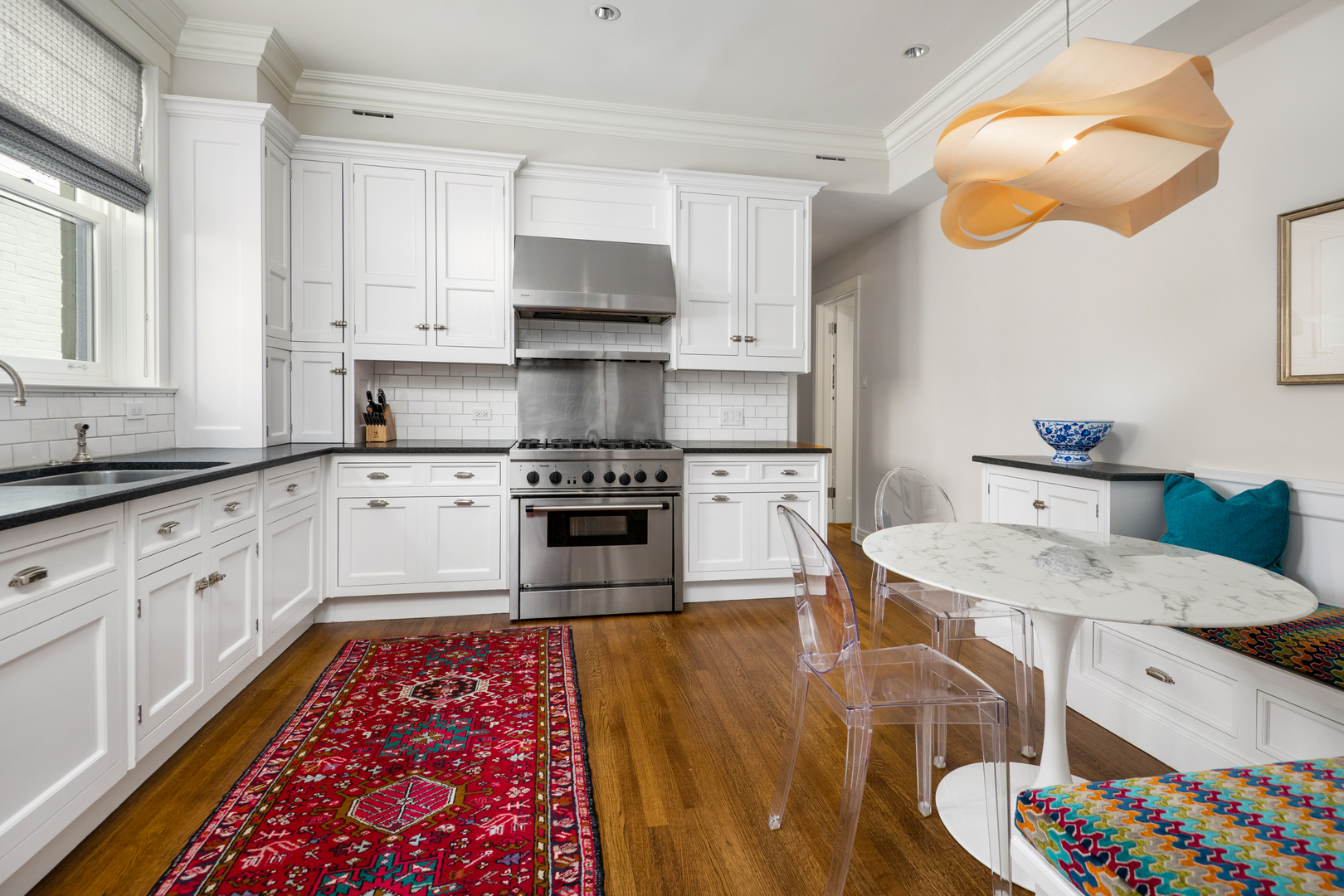 1235 North Astor Street, Unit 2S Chicago, IL 60610 - Photo 6 of 21 a large kitchen with stainless steel appliances granite countertop a sink and cabinets