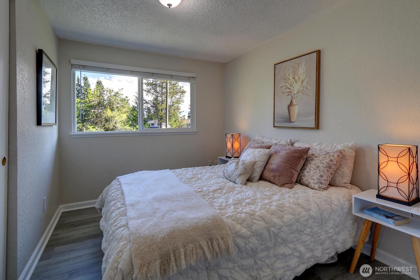 2507 173rd Place Southeast Bothell, WA 98012 - Photo 16 of 30 a bedroom with a bed a window and painting on the wall