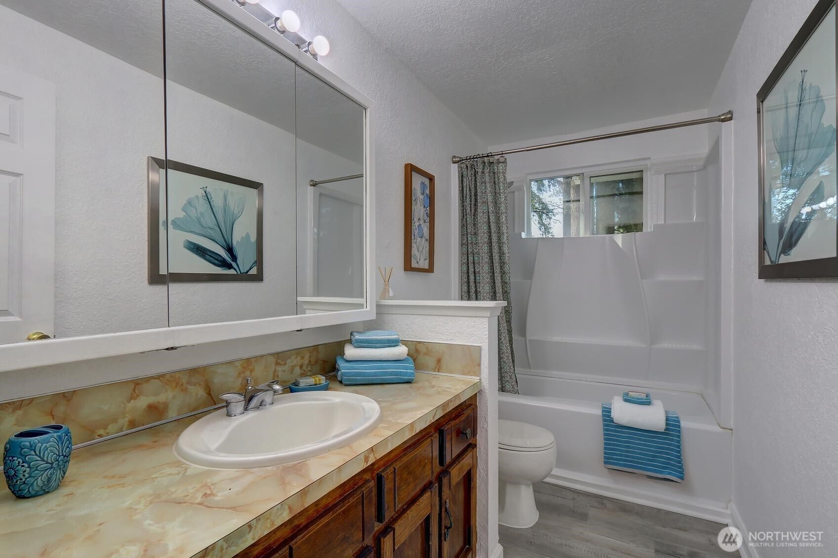 2507 173rd Place Southeast Bothell, WA 98012 - Photo 17 of 30 a bathroom with a granite countertop double vanity sink a mirror and a toilet