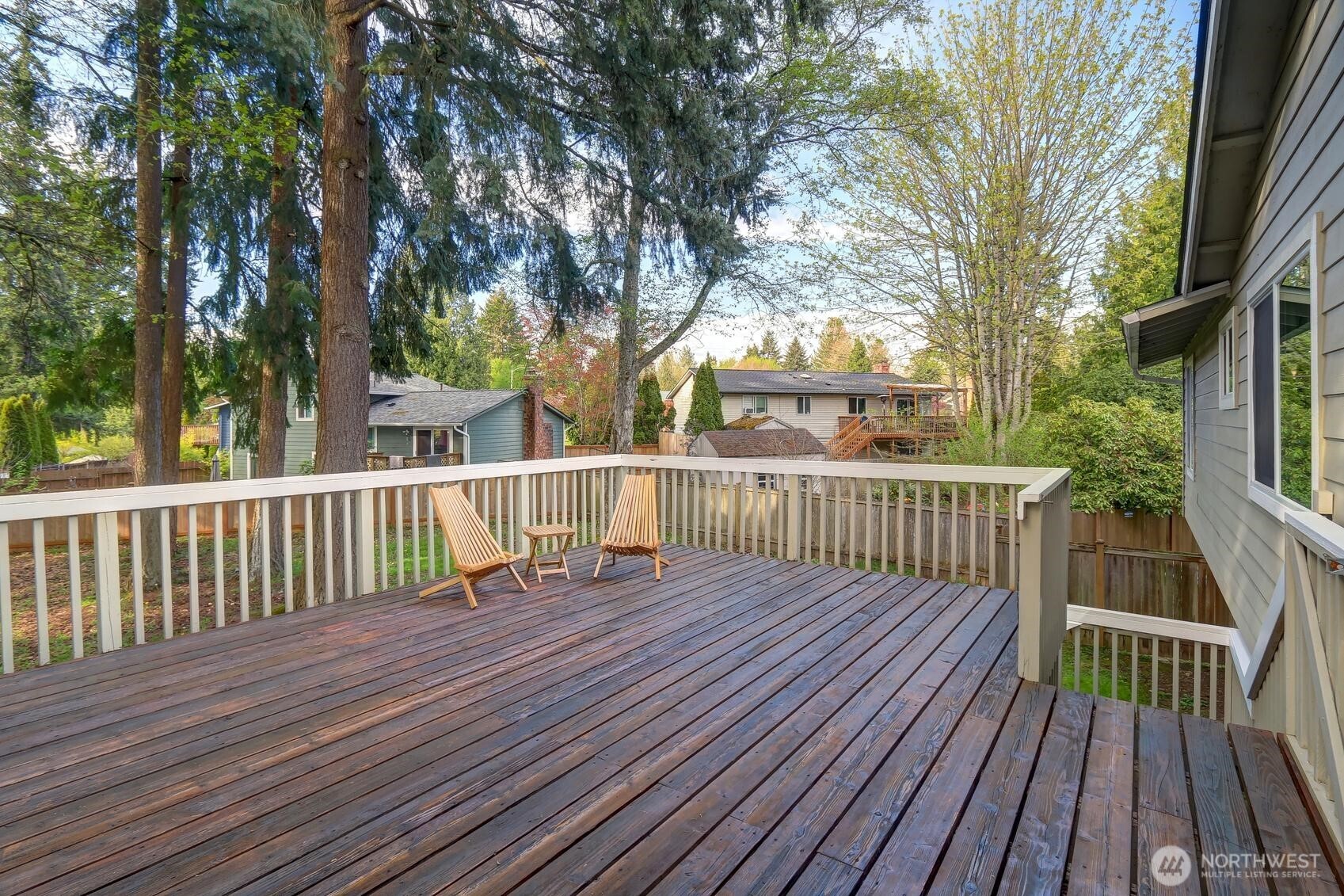 2507 173rd Place Southeast Bothell, WA 98012 - Photo 26 of 30 a view of deck with wooden floor and fence next to a yard