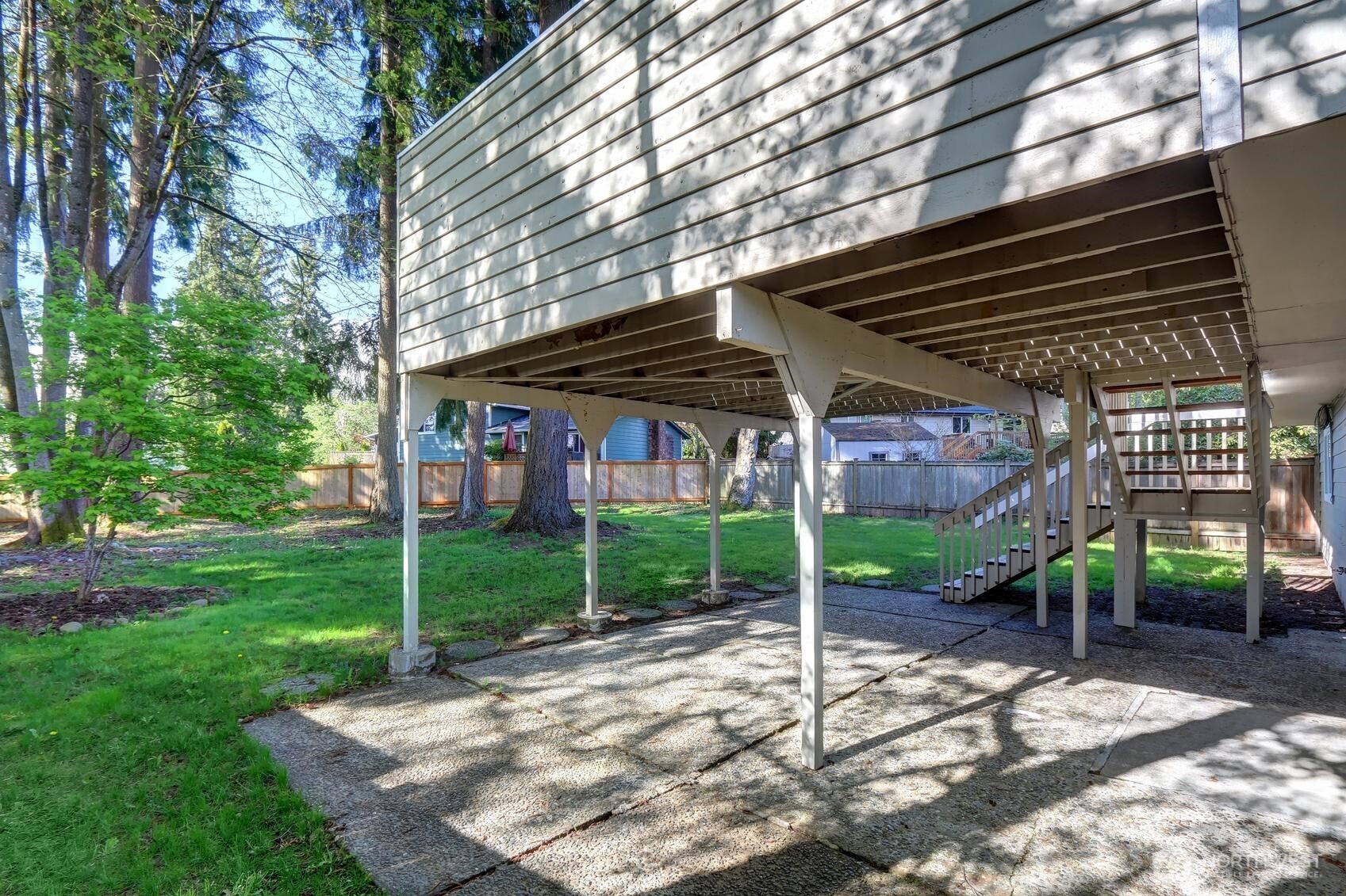 2507 173rd Place Southeast Bothell, WA 98012 - Photo 29 of 30 a view of a house that has a small deck and a backyard