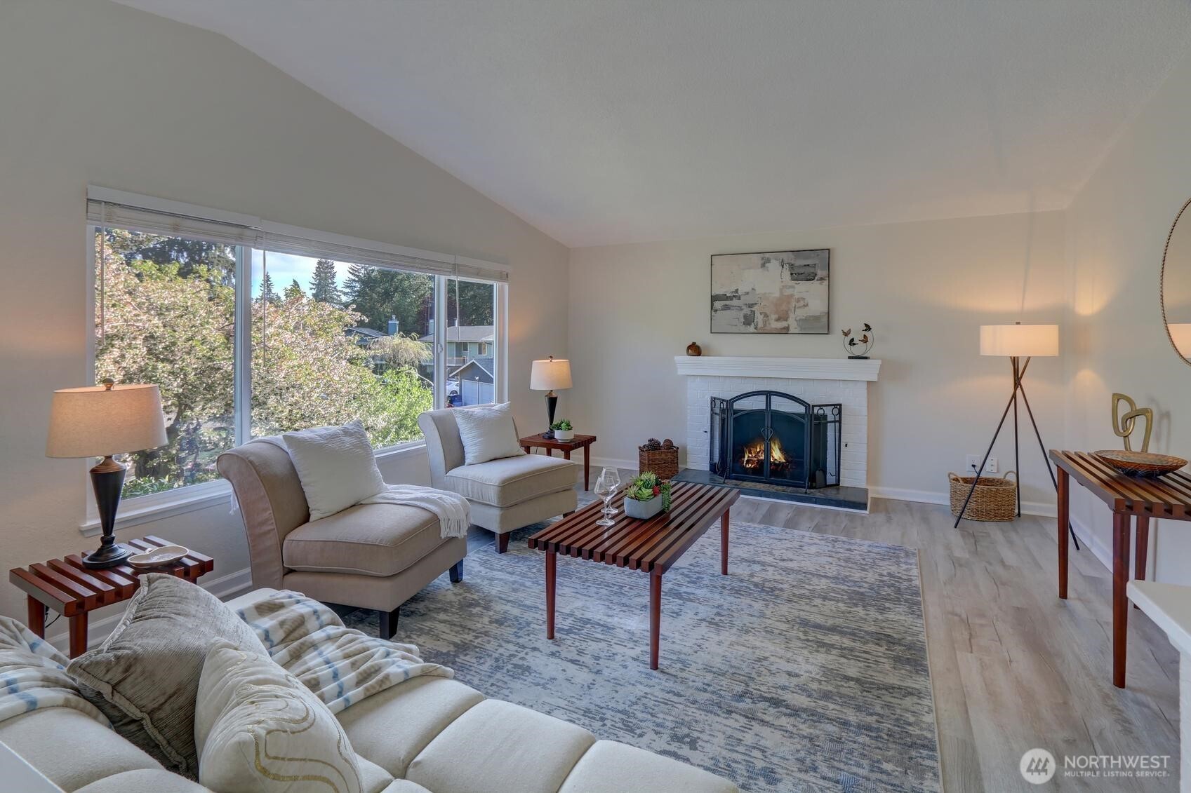 2507 173rd Place Southeast Bothell, WA 98012 - Photo 6 of 30 a living room with furniture a fireplace and a large window