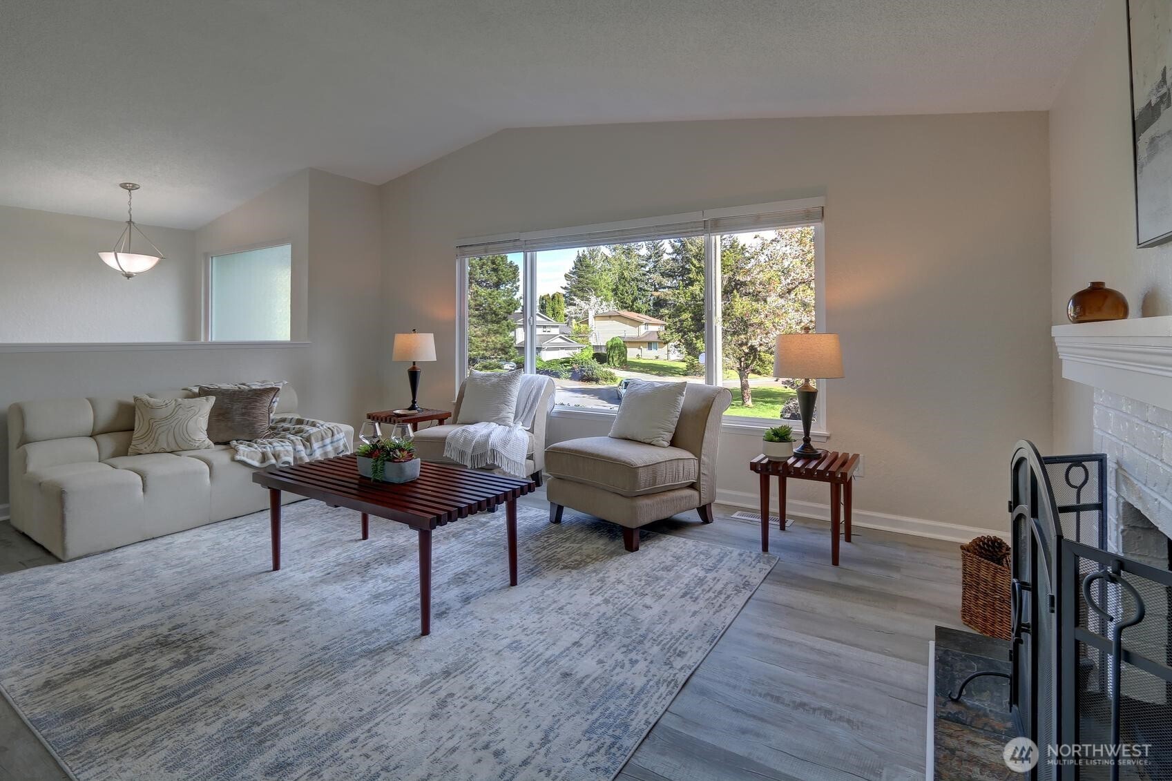 2507 173rd Place Southeast Bothell, WA 98012 - Photo 7 of 30 a living room with furniture a rug and a large window