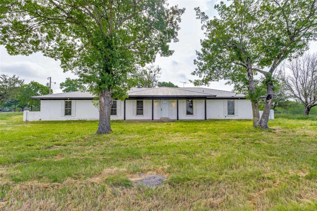 738 Campground Road Sherman, TX 75090 - Photo 9 of 40 a view of a house with a yard and a large tree