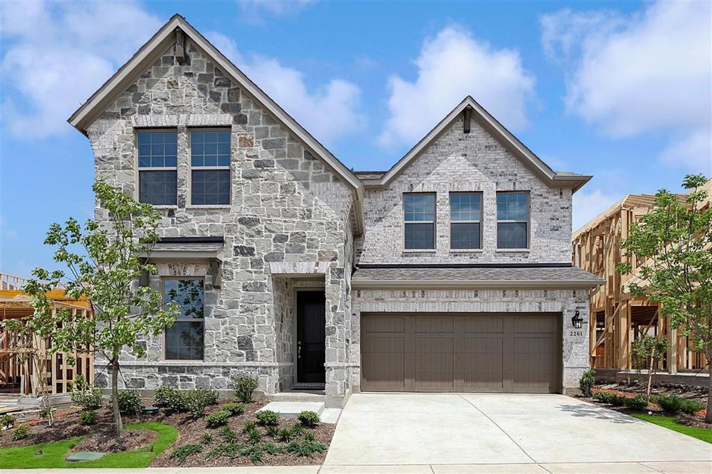 2261 Lexington Way Carrollton, TX 75010 - Photo 1 of 1 a front view of a house with yard