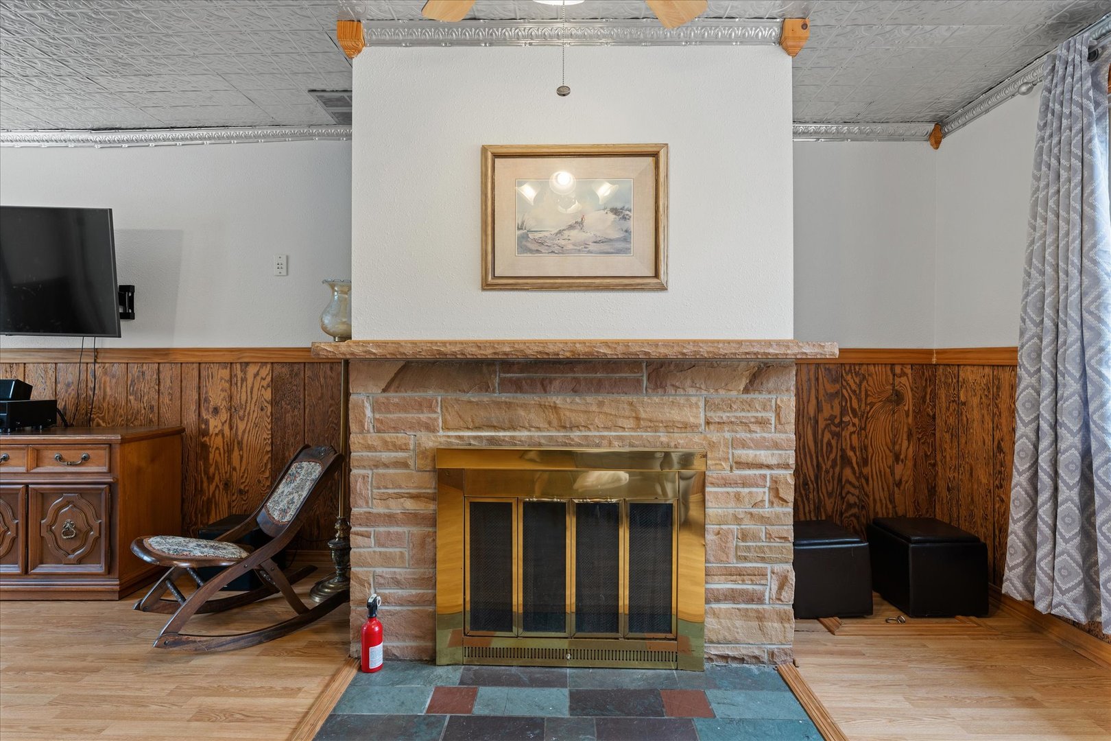 102 North Condit Street Tolono, IL 61880 - Photo 11 of 35 a living room with furniture a flat screen tv and a fireplace