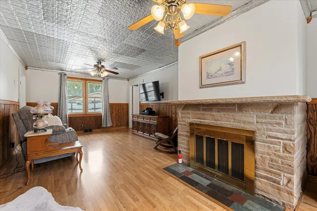 a living room with furniture and a fireplace