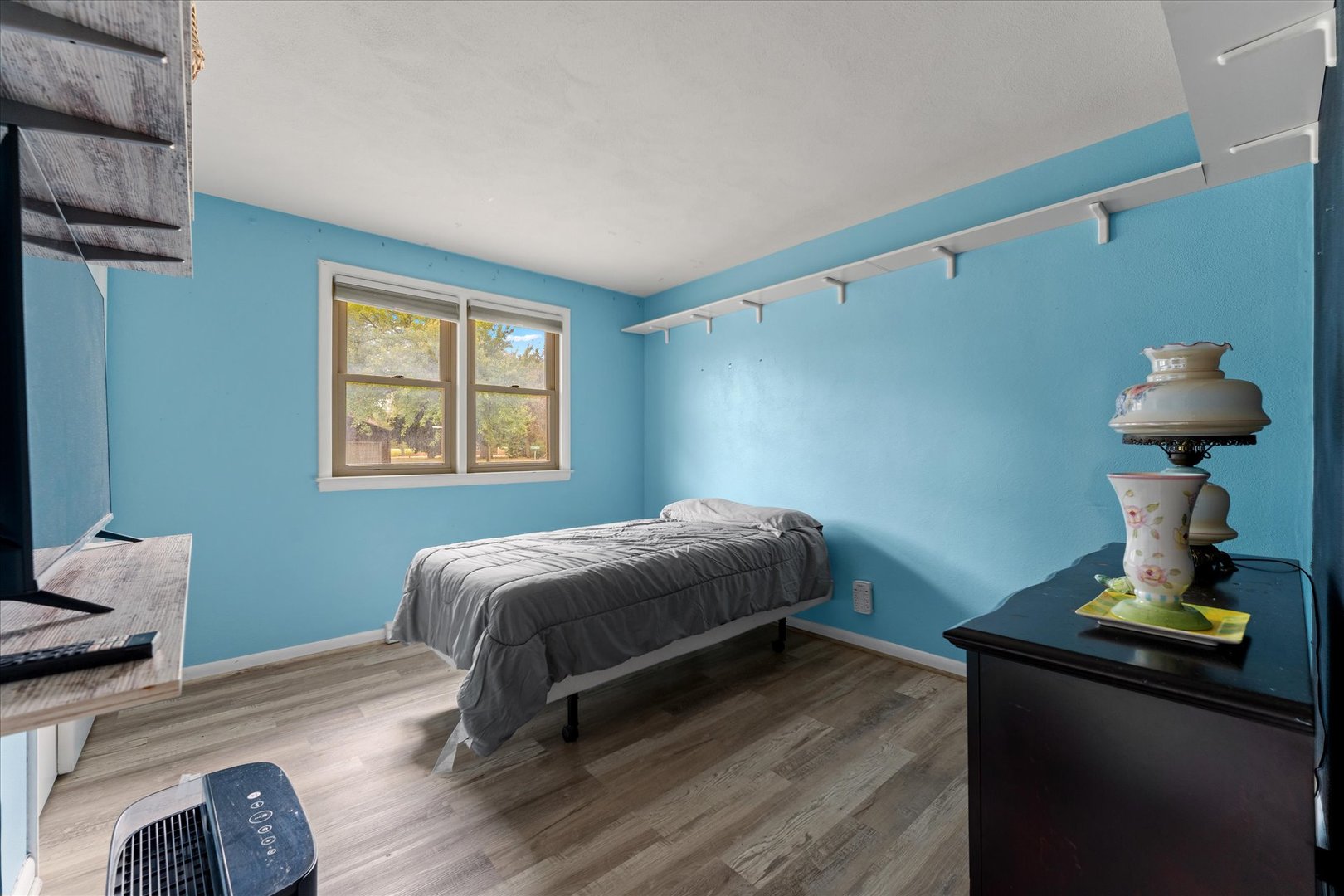 102 North Condit Street Tolono, IL 61880 - Photo 18 of 35 a bedroom with a bed and wooden floor