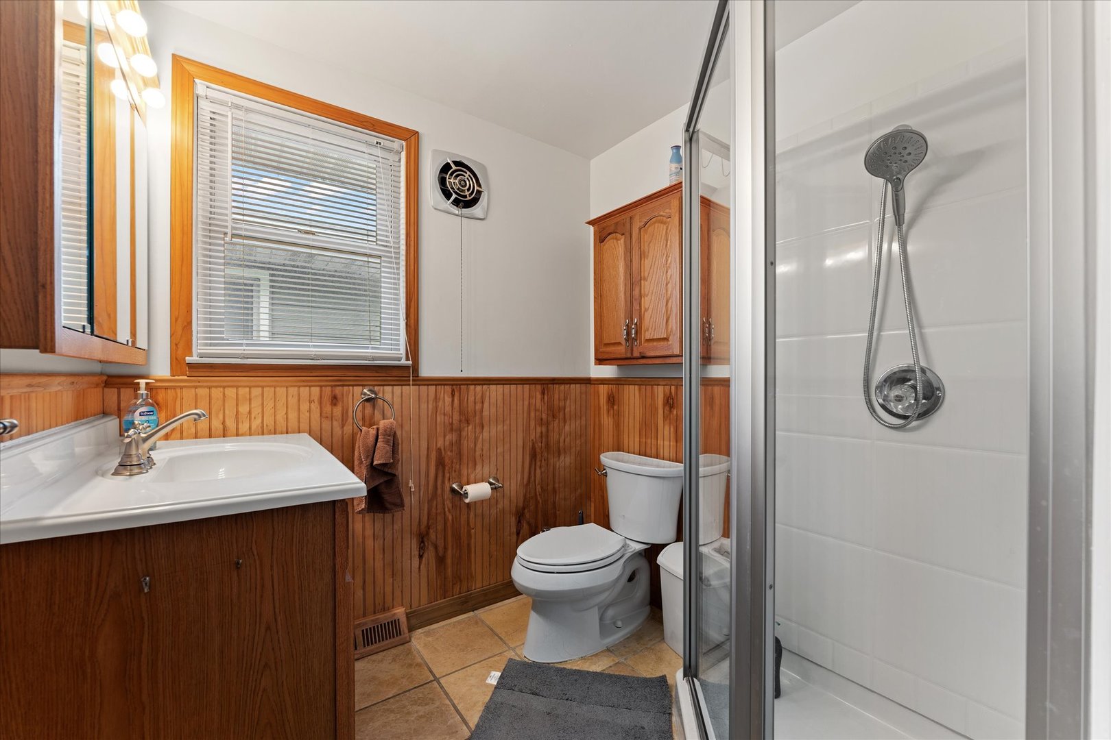 102 North Condit Street Tolono, IL 61880 - Photo 20 of 35 a bathroom with a sink a toilet and shower