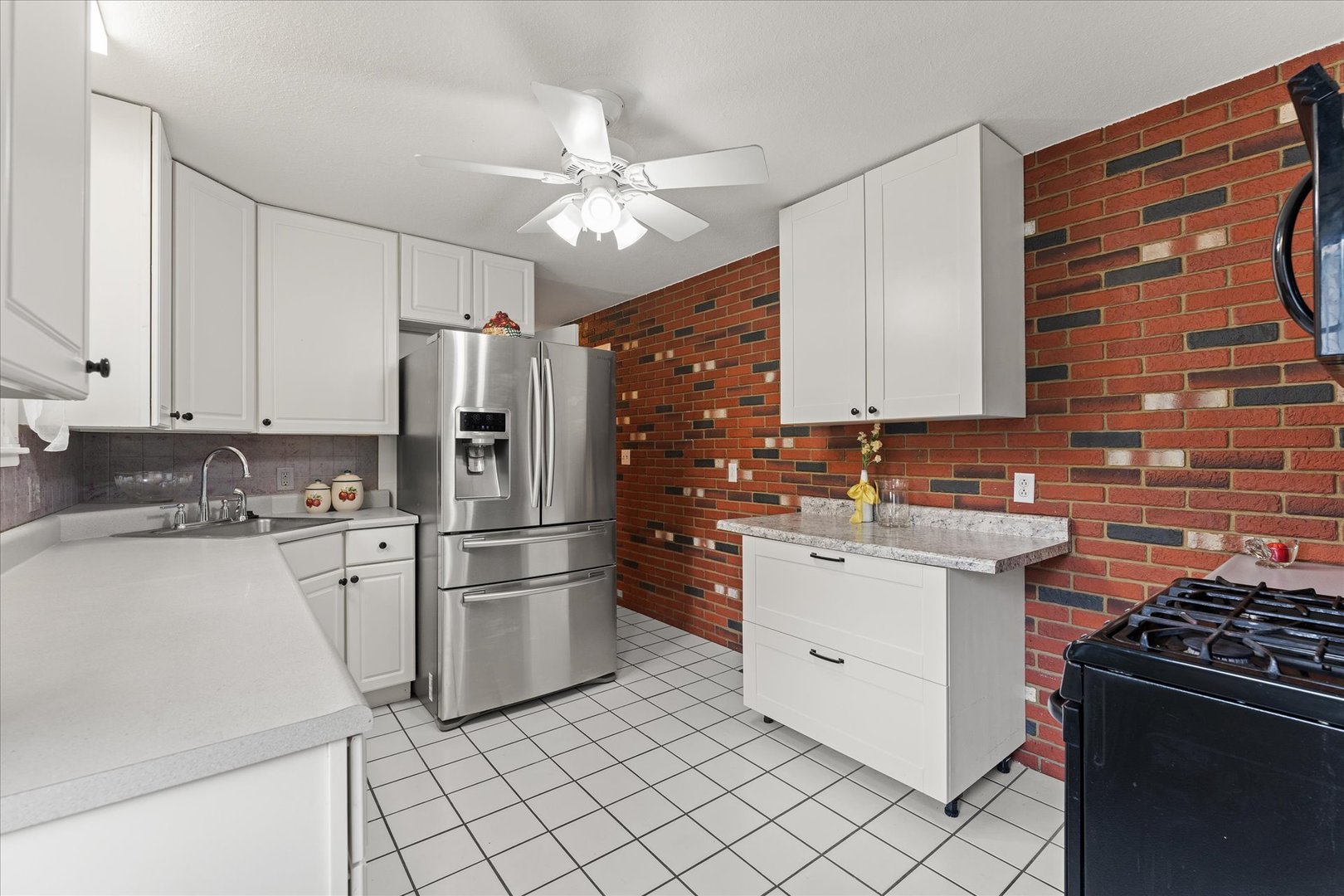 102 North Condit Street Tolono, IL 61880 - Photo 23 of 35 a kitchen with white cabinets and appliances