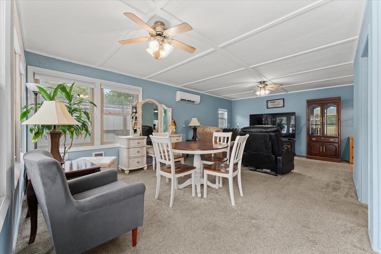 102 North Condit Street Tolono, IL 61880 - Photo 24 of 35 a dining room with furniture a window and a chandelier