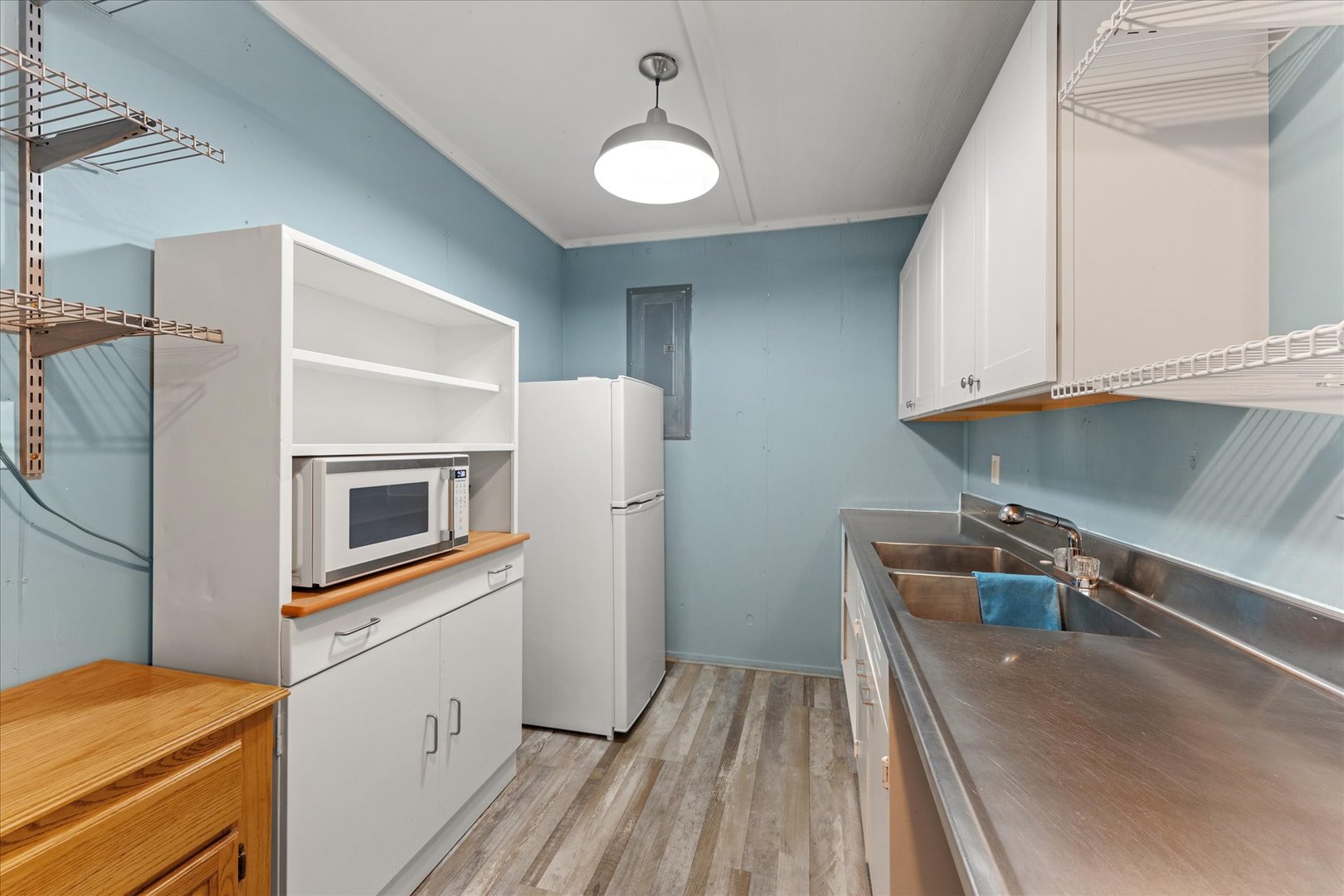 102 North Condit Street Tolono, IL 61880 - Photo 26 of 35 a kitchen with a refrigerator and a sink
