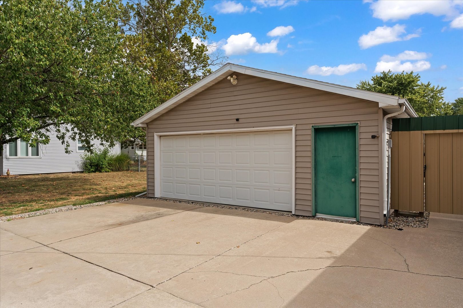 102 North Condit Street Tolono, IL 61880 - Photo 34 of 35 a view of garage yard and tree