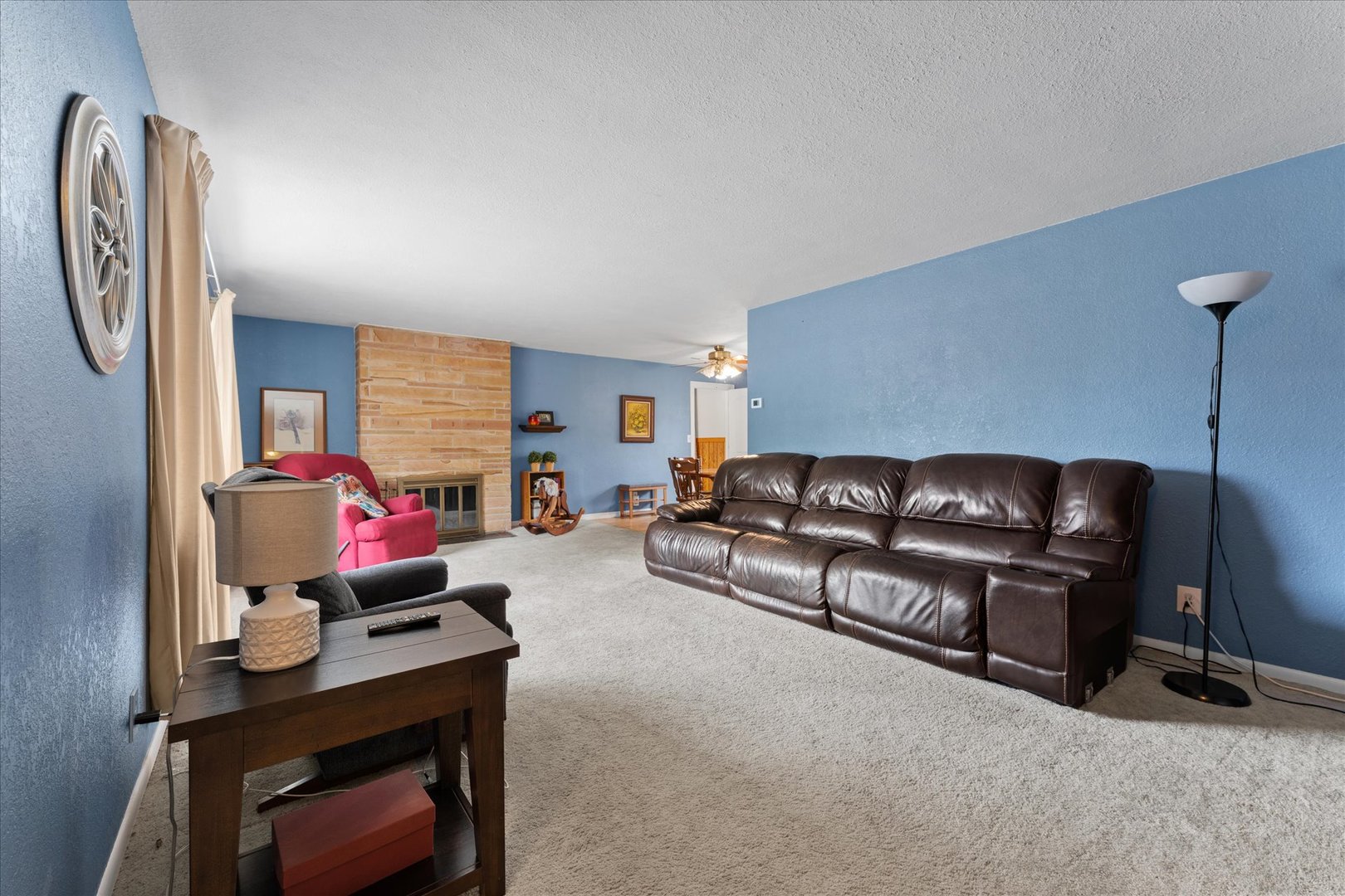 102 North Condit Street Tolono, IL 61880 - Photo 8 of 35 a living room with furniture a flat screen tv and a window