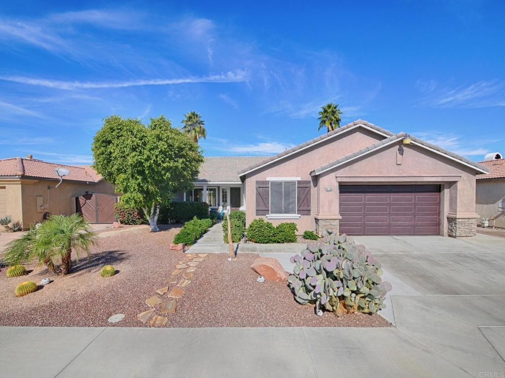 80596 Key Largo Avenue Indio, CA 92201 - Photo 6 of 59 a view of a house with a yard