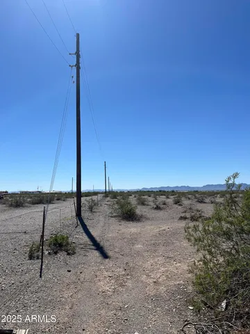 a view of a road with a mountain in the background
