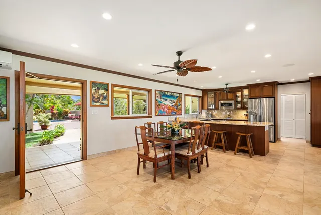 a view of a dining room with furniture window and outside view