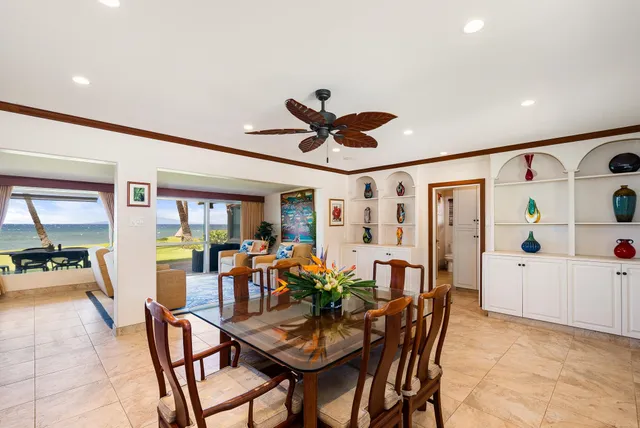 a kitchen with stainless steel appliances granite countertop a stove refrigerator and cabinets