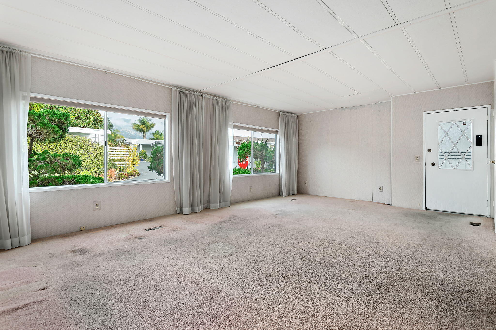 333 Old Mill Road, Unit 157 Santa Barbara, CA 93110 - Photo 3 of 12 an empty room with windows and mountain view