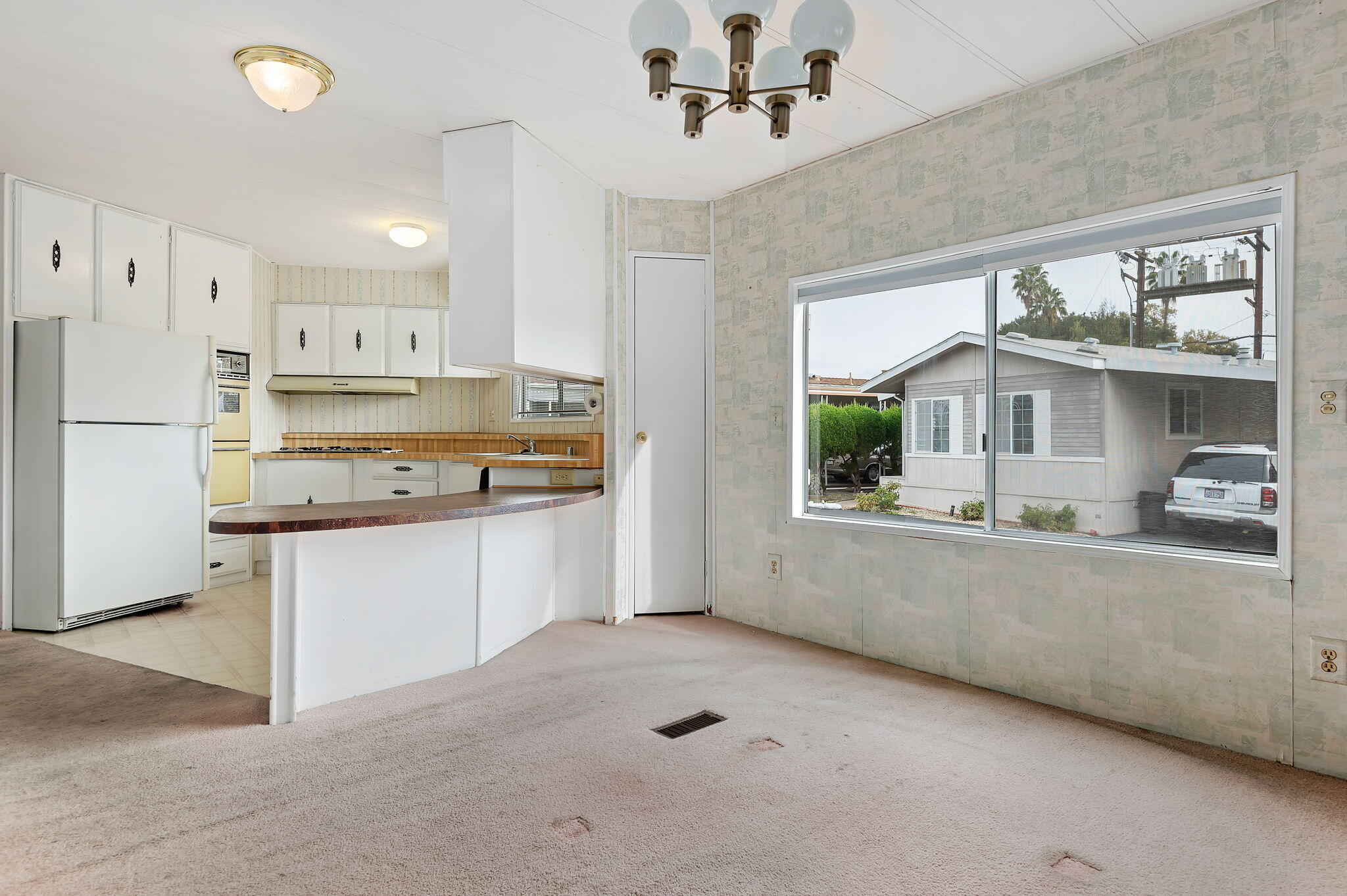 333 Old Mill Road, Unit 157 Santa Barbara, CA 93110 - Photo 7 of 12 a kitchen with stainless steel appliances granite countertop a stove and a refrigerator