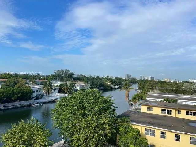 an aerial view of residential house with outdoor space and lake view