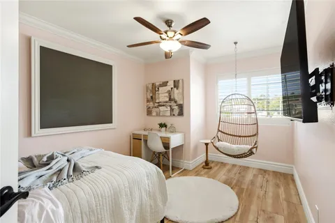 a bedroom with a bed and a couch