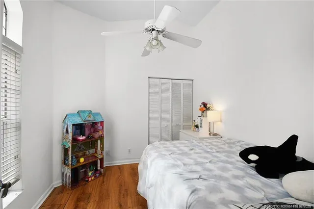 a view of a workspace with furniture and a book shelf