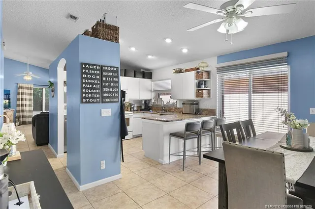 a kitchen with a refrigerator and a sink
