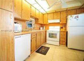 a kitchen with stainless steel appliances a refrigerator and a stove