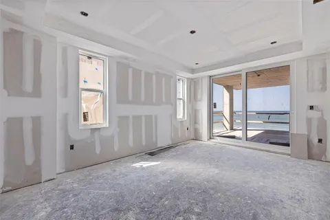 a view of empty room with windows