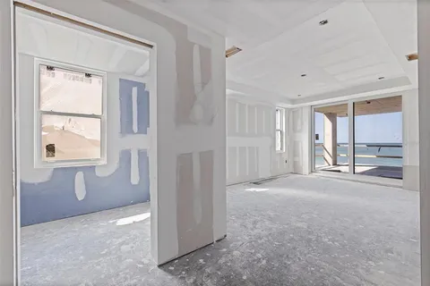 a view of livingroom with an empty space and window