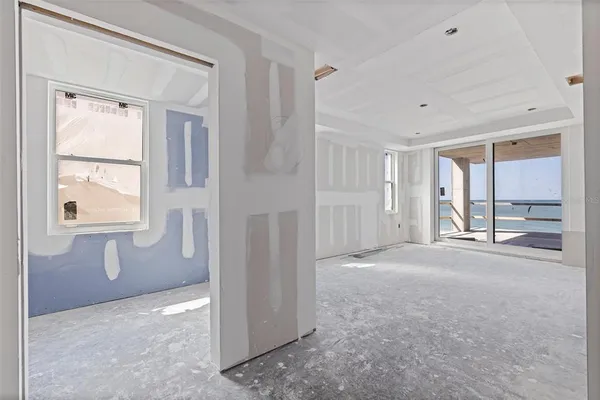 a view of livingroom with an empty space and window