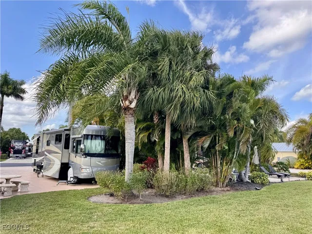 a view of a fountain in front of a house