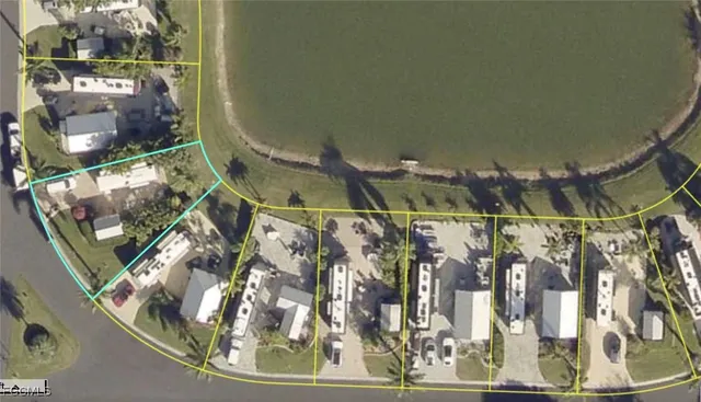 front view of a house with a yard and potted plants