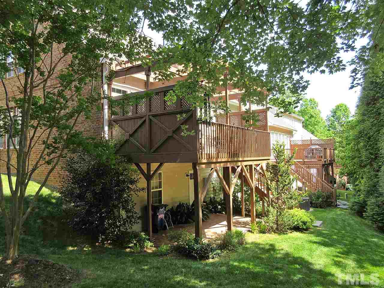 3920 Sunset Maple Court Raleigh, NC 27612 - Photo 23 of 30 View of Privacy Fence from Upper Deck and Ground Level Patio.