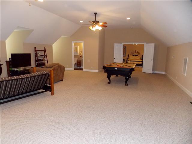 2830 Burgess Gower Road Springfield, TN 37172 - Photo 11 of 20 Ready to play? The pool table conveys, so much space for all your toys and activities! Guest room is accessed through the double doors or would be perfect for in-law suite, or college students. Complete with 3/4 Bath! This Bonus Room has it all!