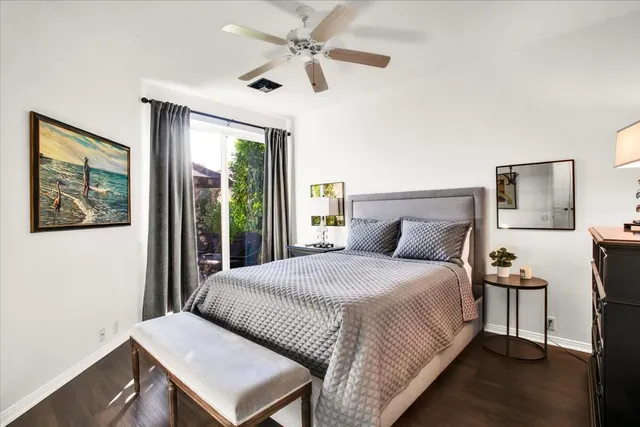 a bedroom with a bed and a night stand