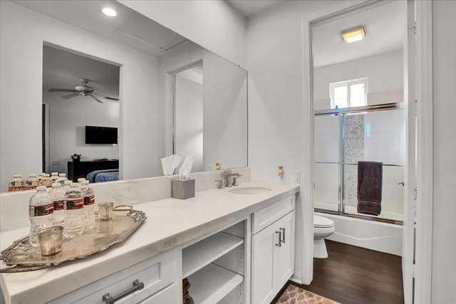 a bathroom with a double vanity sink and mirror