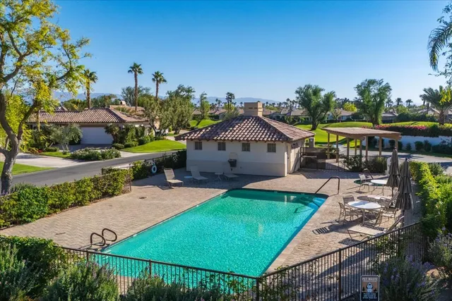 a view of a yard and front view of a house