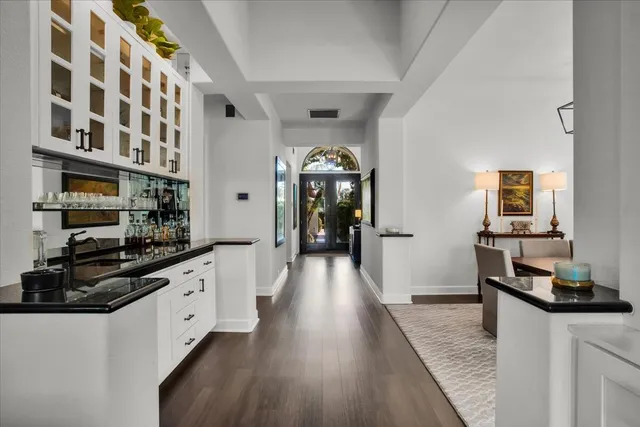a kitchen with stainless steel appliances granite countertop a stove and cabinets
