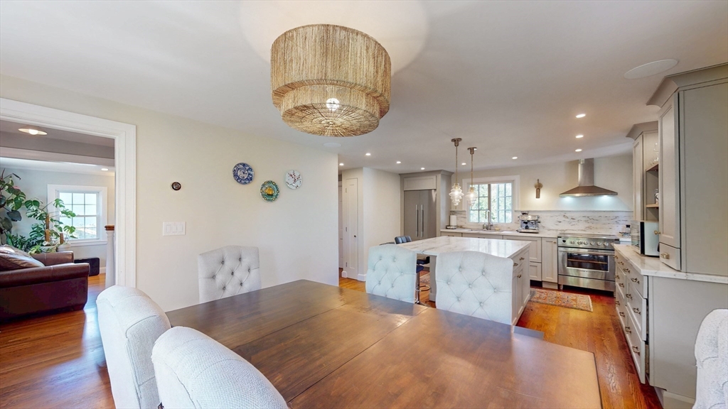 49 Ripley Road Medford, MA 02155 - Photo 15 of 27 a large kitchen with a table and chairs in it