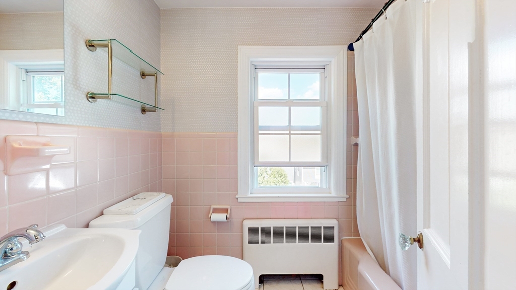 49 Ripley Road Medford, MA 02155 - Photo 21 of 27 a bathroom with a sink toilet and window