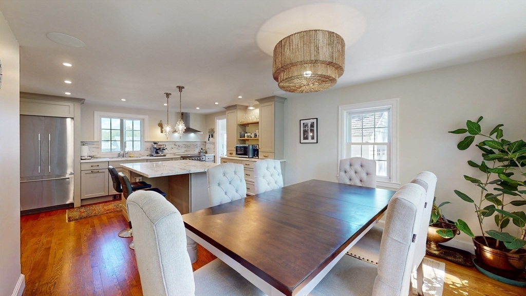 49 Ripley Road Medford, MA 02155 - Photo 3 of 27 a living room with dining table and wooden floor