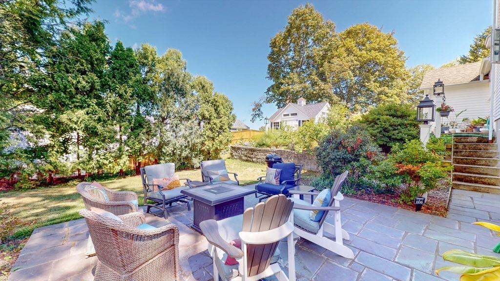 49 Ripley Road Medford, MA 02155 - Photo 4 of 27 a view of a chairs and table in a patio